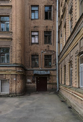Fototapeta na wymiar Traditional old yard in Saint-Petersburg, Russia, ancient retro building
