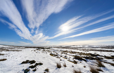 Snow cover moors on a frozen winters day with a bright blue sky at the remote Edmondbyers Common,...