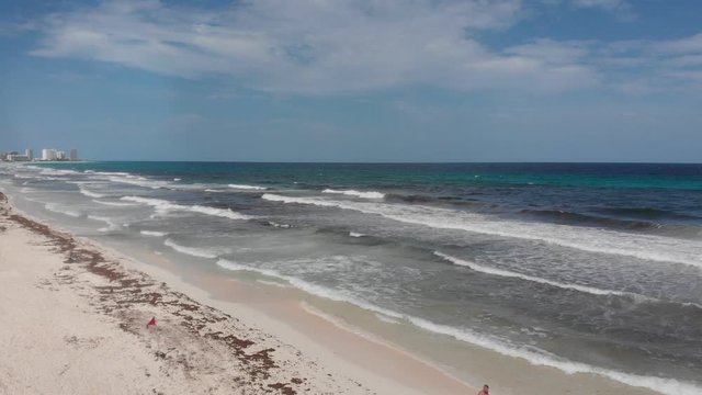 Aerial View Of White Beach And Coastline With Red Flag Warning In Cancun.