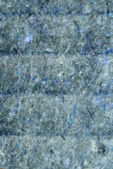 Texture of blue felt fabric with pile and thread, closeup background