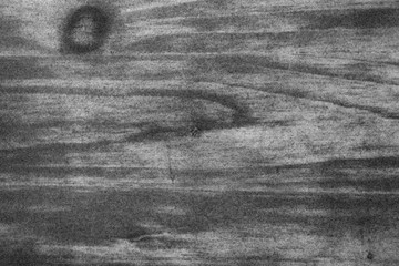 Blurred wooden texture and background with film grain. 