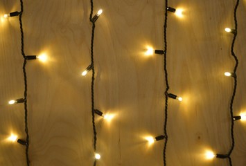  beautiful yellow background made of wooden wall decorated with lights