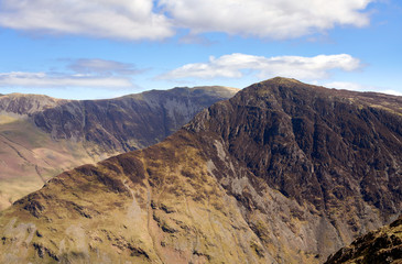 Fototapeta na wymiar The mountain ridge leading to the summit of Fleetwith Pike with views of Dale Head in the distance in the English Lake District.