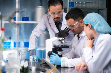 Health care researchers working in life science laboratory