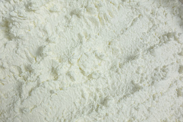 Textured white substance background. Foam consistence backdrop closeup view of ice cream, cotton cheese or snow like. Mock-up or template for design banner and poster