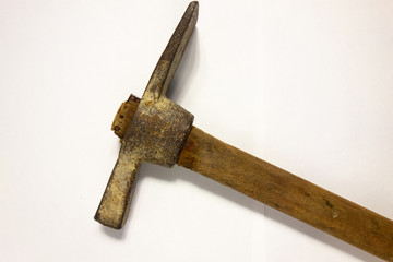 Miner hammer like pickaxe or mattock on white isolated background with shadow. Closeup view of rustic old hand tool for hard working to extract fossils or concept of block chain currency mining