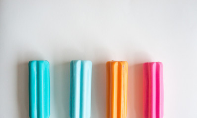 Background with colorful screwdriver handles from the bottom on white background