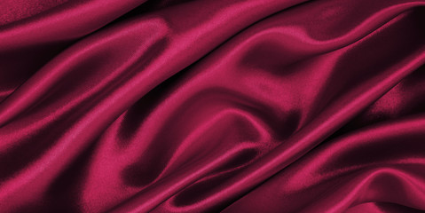 Smooth elegant pink silk or satin luxury cloth texture as abstract background. Luxurious valentines...