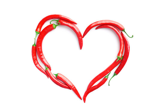 Red Chilli Peppers Laid Out In Form Of Heart On White Background. Concept Of Passion, Addiction To Spicy Food, Valentines Day