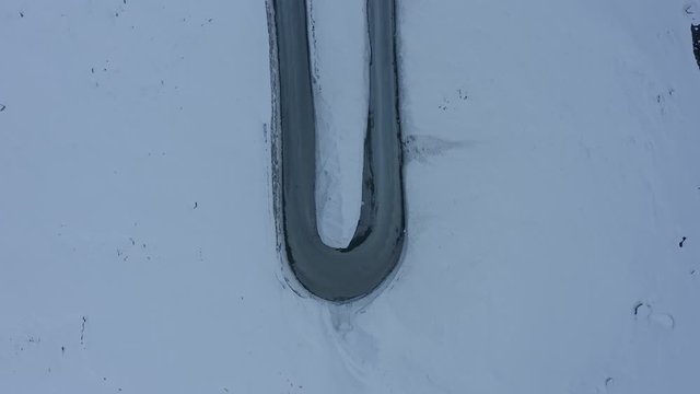 Aerial view showing a U Turn at the Timmelsjoch Pass, top down shot.