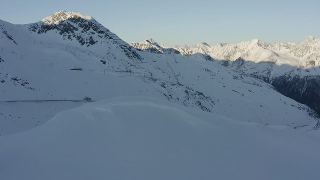 Backward moving shot featuring Passo del rombo and a t-bar lift in Soelden.