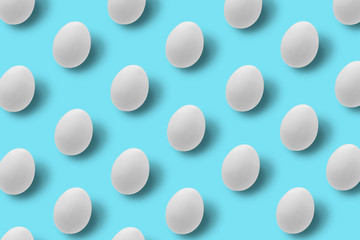 Easter white eggs on blue background.