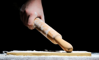 a chef with his hands in flour is preparing to cook a meal on a black background