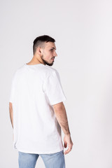 The man in the t-shirt.