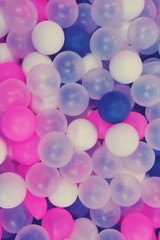 Background of colored balls of the same size, texture muted soft tones