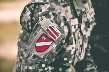 Identification signs on the uniform of the Latvian Army - obrazy, fototapety, plakaty