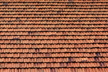 Texture of new tiled roof with brown color, close-up