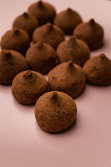 Chocolate truffles in dark background with copy space.