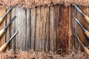 Carpentry, wooden background. Tools under a wooden Board.