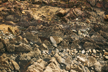 The rocky texture on the ocean. Goa coast, Arambol