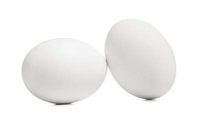 Raw chicken eggs on white background