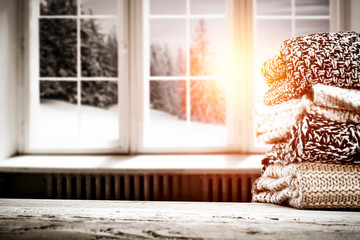 Fototapeta premium Desk of free space and winter window background 