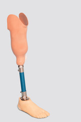 Prosthetic leg over grey background