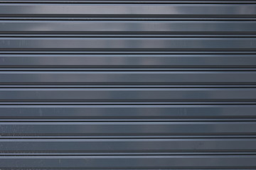 black roller shutter door closed security background