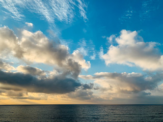 landscape of the sea horizon with sky with clouds at sunset