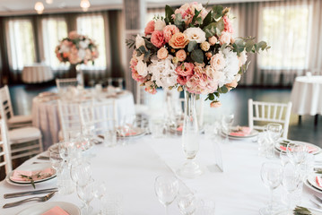 Festive table setting with a floral arrangement in the center and with a table number