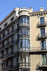 Fototapeta premium Ornate Barcelona Apartment Building with Balconies & Glass & Steel Round Tower 