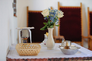 Church sanctuary before a wedding ceremony. Empty chairs for bride and groom.