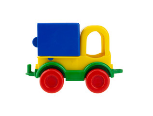 Small plastic toy truck isolated on white background. Side view.