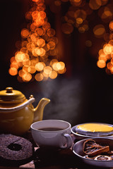 Obraz na płótnie Canvas brewing tea in a festive christmas background