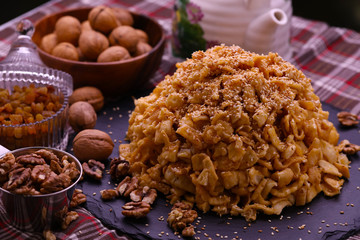 Georgian dessert Chuck Chuck surrounded by nuts.