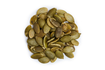 Raw shelled pumpkin seeds isolated on white background