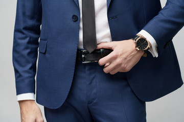 studio shot stylish businessman wearing suit and watches