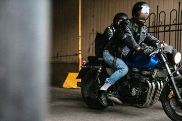 Photo of bearded men bikers wearing helmets sitting on their bikes