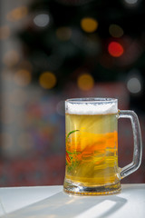 Mug of beer on wooden background