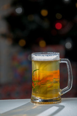 Mug of beer on wooden background