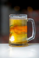 Mug of beer on wooden background