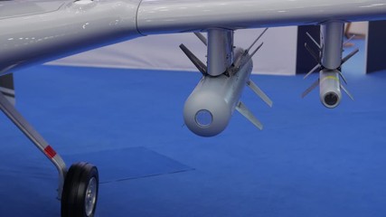 UAV drone missiles closeup military gray combat unmanned aircraft reconnaissance aerial vehicle camera movement