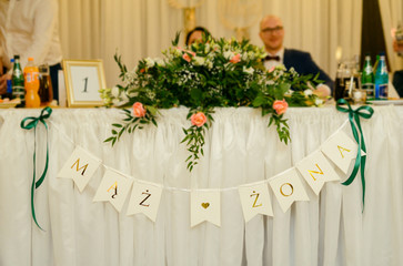 Beautifully decorated wedding table and other details at wedding hall. Wedding day.