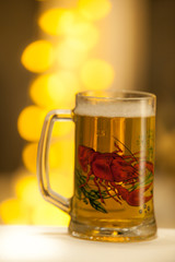Mug of beer on wooden background