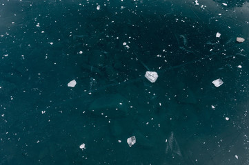 chunks of ice on frozen lake Oeschinensee in the Bernese Alps