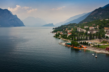 Fototapeta na wymiar Panorama of one of the most beautiful cities on lake Garda in the province of Veneto in Northern Italy - Malcesine, view of the promenade, Scaliger castle and the Lago di Garda