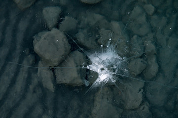 ice structure with beautiful lines on frozen lake