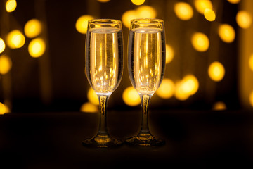 Two glasses of pink champagne for the couple.