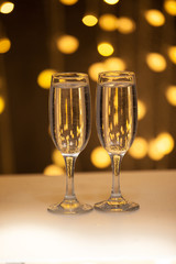 Two glasses of pink champagne for the couple.