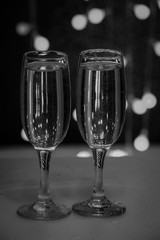 Two glasses of pink champagne for the couple.